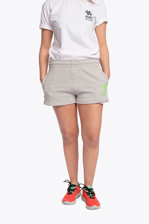 Osaka Women Short - Padel Classic | Heather Grey Osaka women shorts in grey with neon green logo. Front flatlay view