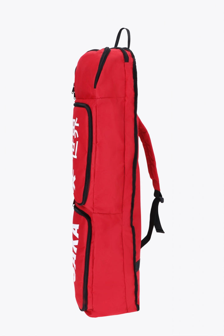 Osaka sports stickbag medium in red with logo in white. Side view