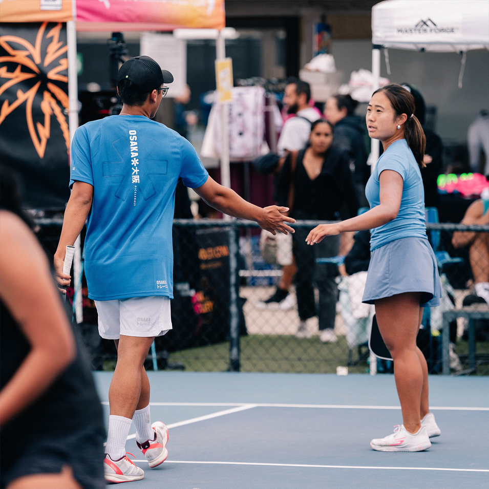 OSAKA Pickleball Athlete Ninh Nguyen high-fiving doubles partner