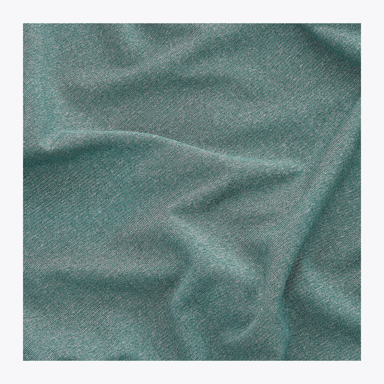 Detailed view of the soft, lightweight moisture-wicking performance fabric used in the Osaka Men’s Apex Training Tee in Pineneedle green.