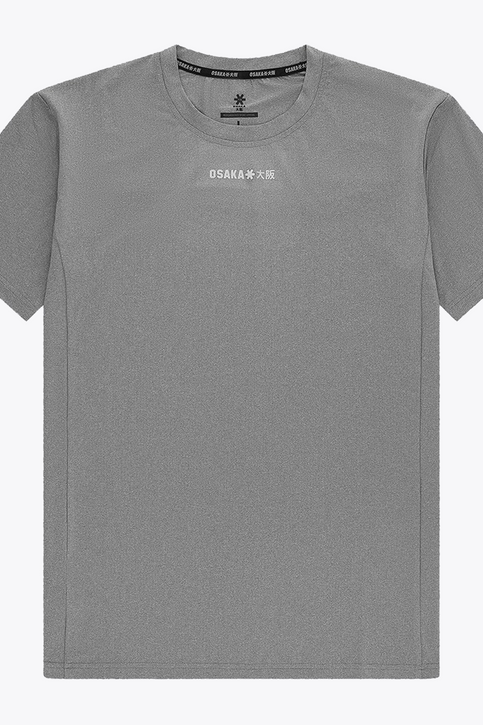 Osaka Men Apex Training Tee | Quiet Gray Black male model wearing Osaka Men’s Apex Training Tee in Quiet Gray and white training shorts, showcasing reflective chest branding, athletic fit, and breathable training fabric.