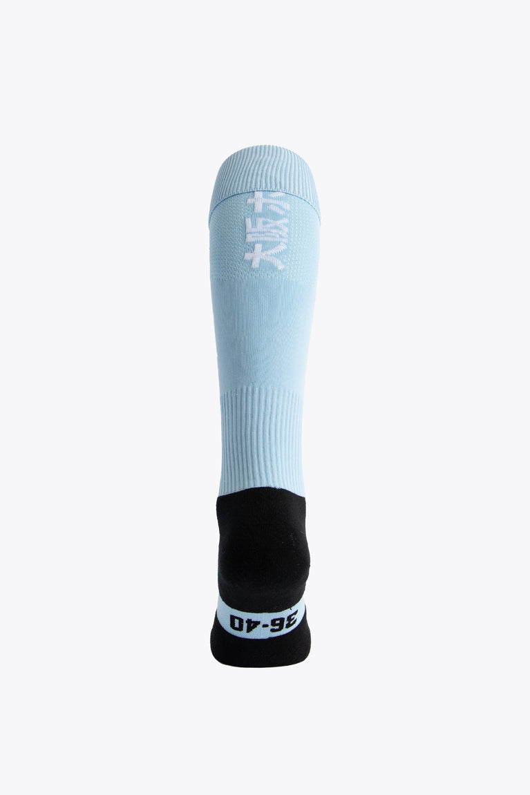 Osaka Field Hockey Socks in light blue with Osaka logo in green. Back view