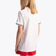 Girl wearing the Osaka Kids Jersey in white. Back view