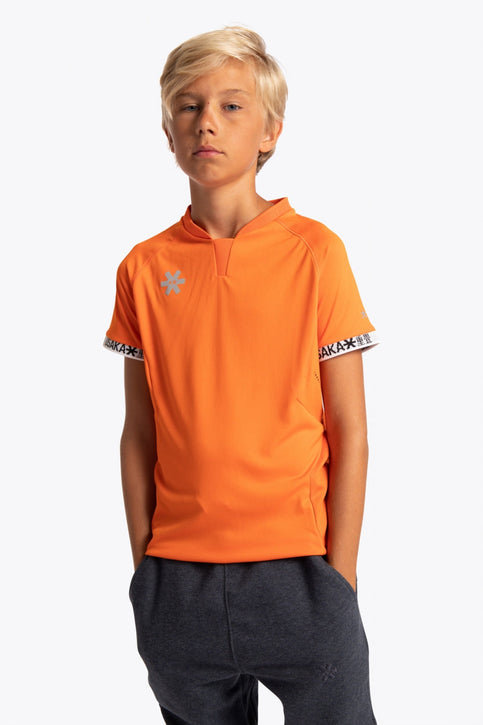 Osaka Kids Jersey | Orange Boy wearing the Osaka Kids Jersey in Orange. Front view