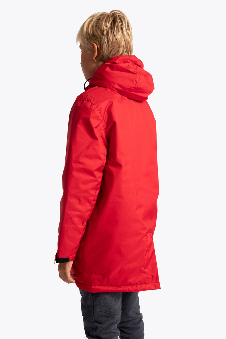Boy wearing the Osaka Kids Stadium Jacket in Red. Back view