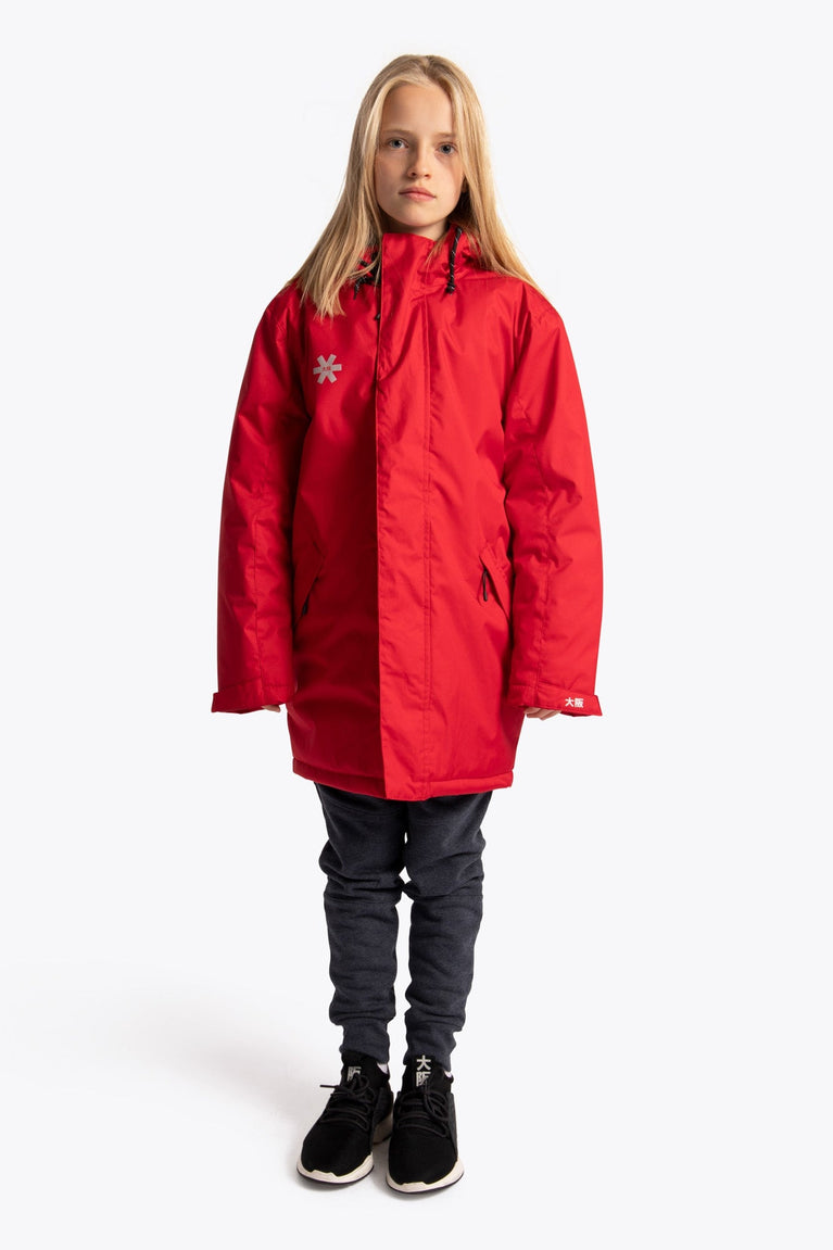 Girl wearing the Osaka Kids Stadium Jacket in Red. Front view