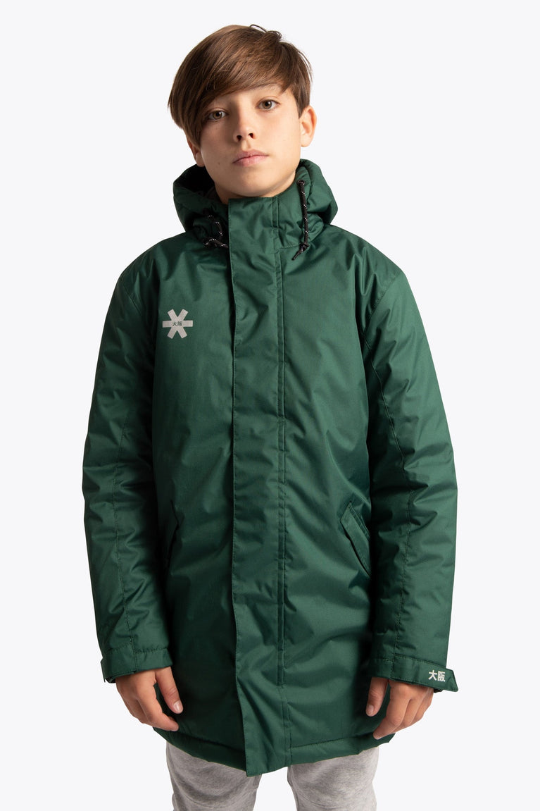 Boy wearing the Osaka Kids Stadium Jacket in Dark Green. Front view