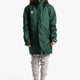 Girl wearing the Osaka Kids Stadium Jacket in Dark Green. Front view
