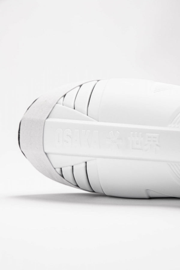 Osaka Shinguard white and black with logo. Logo view