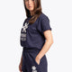 Woman wearing the Osaka women shorts in navy with white logo. Side view
