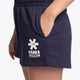 Woman wearing the Osaka women shorts in navy with white logo. Side detail logo view