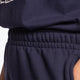 Osaka women shorts in navy with white logo. Front detail stretch view