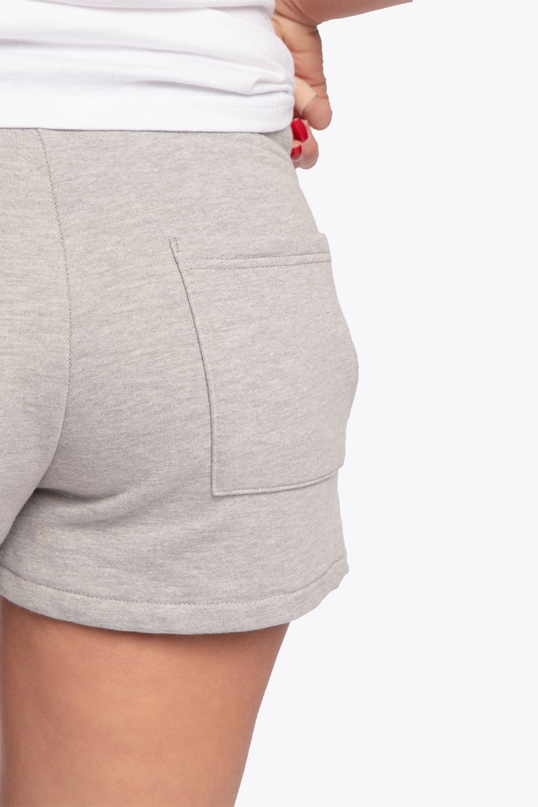 Osaka women shorts in grey with neon green logo. Back detail pocket view