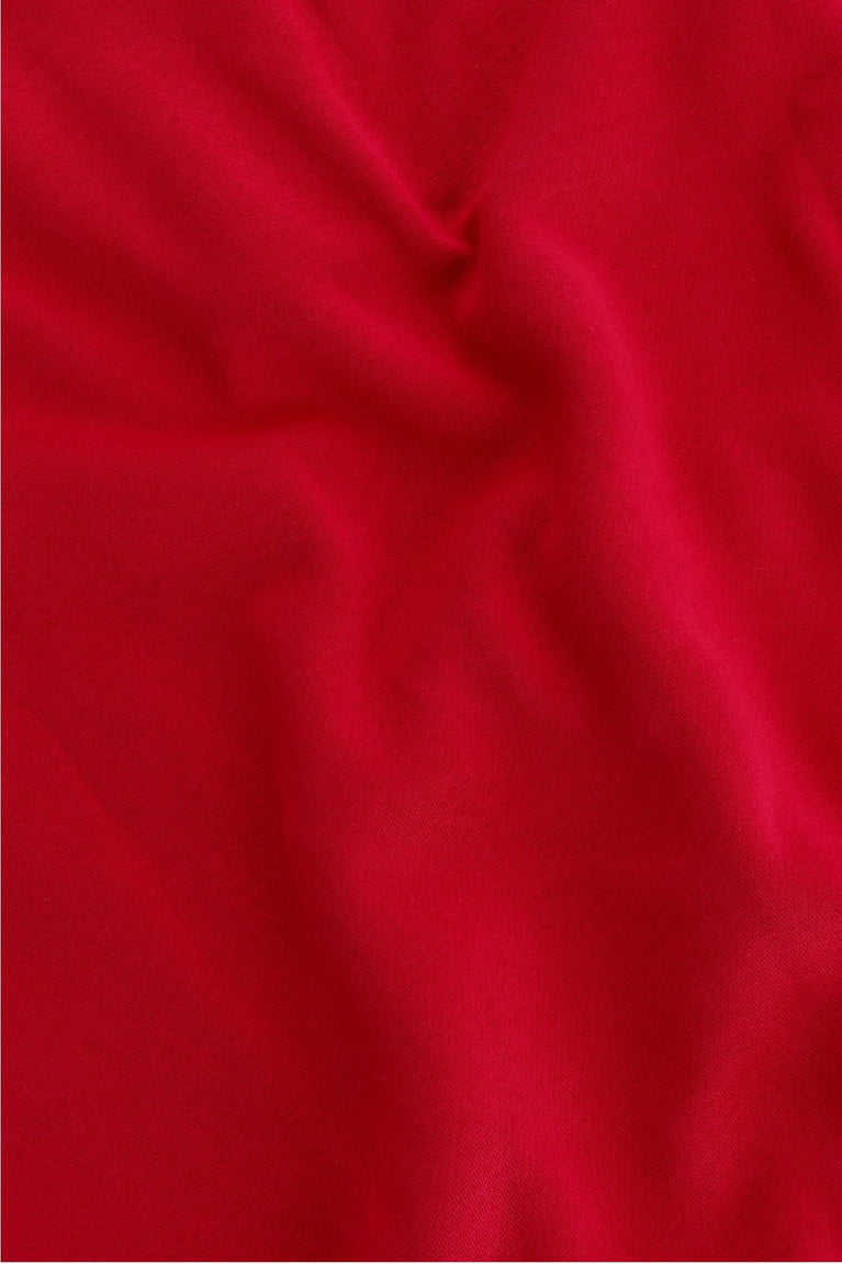 Osaka women half zip sweater in red with white logo. Detail fabric view