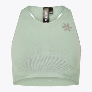 A pale sage green athletic crop top by OSMA, featuring a scoop neck, underwire cups, a textured knit pattern, and a gray logo on the left chest, displayed on a clean white background. #Jadeite