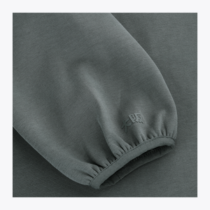 Dark grey melange unisex hoodie sleeve cuff with small embroidered emblem #DarkGreyMelange