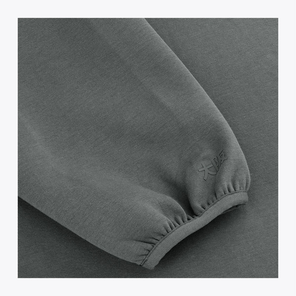 Unisex sweater sleeve cuff close-up in dark grey melange with ribbed knit #DarkGreyMelange