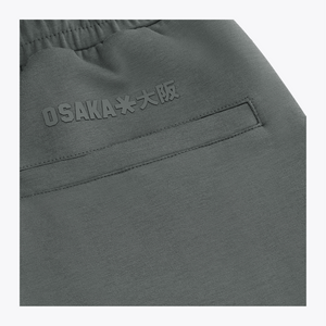 Dark grey sweatpants with raised logo print near the waistband #DarkGreyMelange