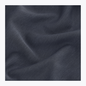 A close-up of navy fabric with soft folds and a smooth texture, presented as a material or color sample. | Osaka World USA #Navy