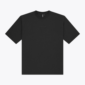 A black boxy crewneck t-shirt with a small, tonal embroidered logo on the center chest, displayed flat against a light gray background. | Osaka World USA #Black