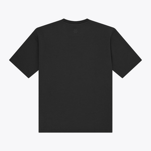 A black boxy short-sleeve t-shirt shown from the back, featuring a small tonal embroidered logo centered below the neckline, set against a plain white background. | Osaka World USA #Black