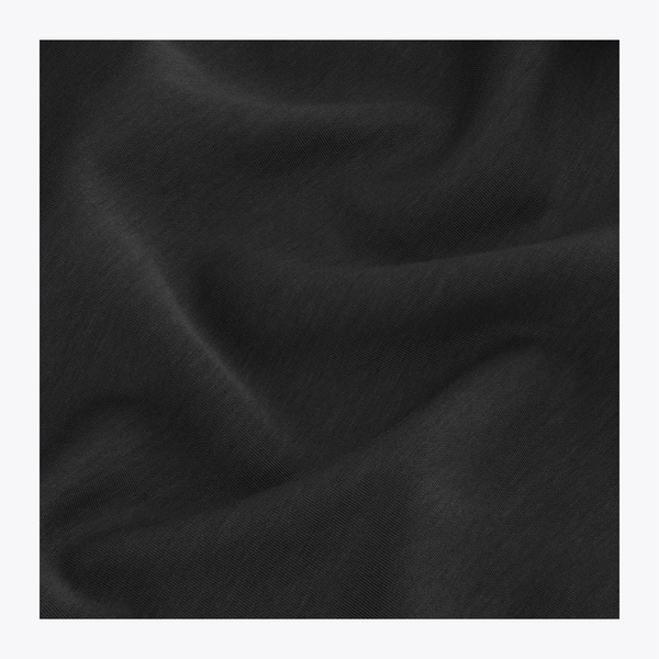 A close-up of black fabric with soft folds and a smooth texture, presented as a material or color sample. | Osaka World USA #Black