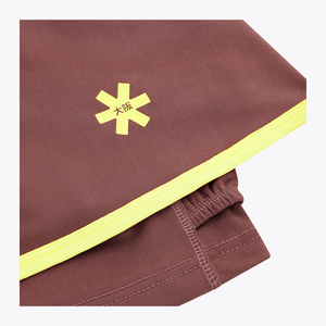 Osaka Women Floucy Active Skort| #Peppercorn | Close up of front logo
