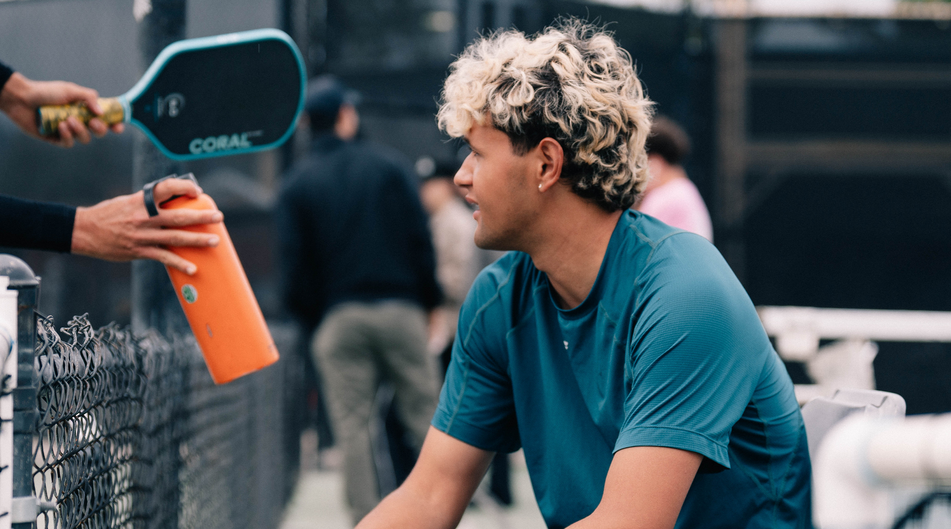 Andrew_Garcia_Osaka_pickleball_athlete_taking_a_courtside_break_between_matches
