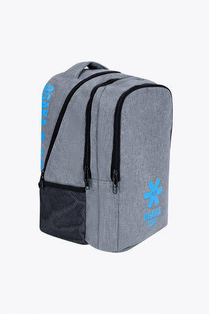 Osaka sports backpack in light grey with logo in blue. Side view