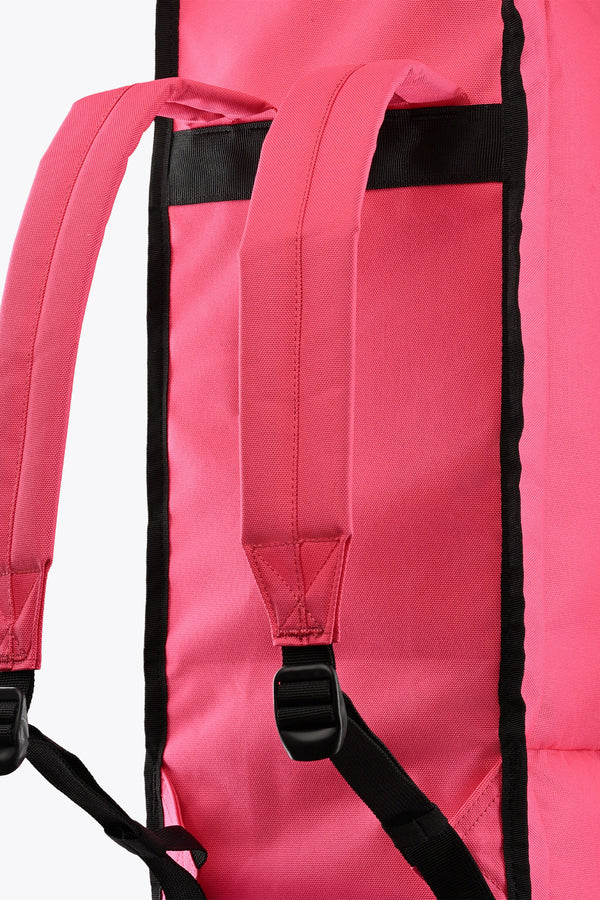 Hot pink stickbag interior with black trim and adjustable shoulder strap