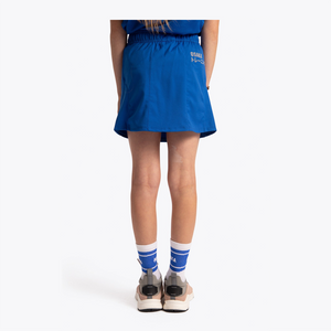 Osaka Kids Training Skort #RoyalBlue | on model behind