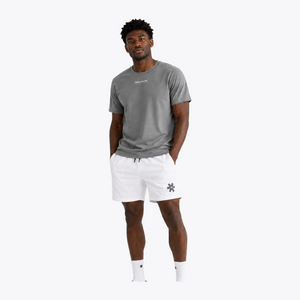 Black male model wearing Osaka Men’s Apex Training Tee in Quiet Gray and white training shorts, showcasing reflective chest branding, athletic fit, and breathable training fabric. #QuiteGray