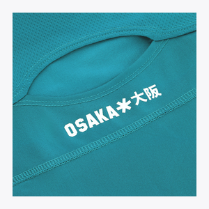 Osaka World Floucy Dress Transformative Teal | #TransformativeTeal | Close up of back logo