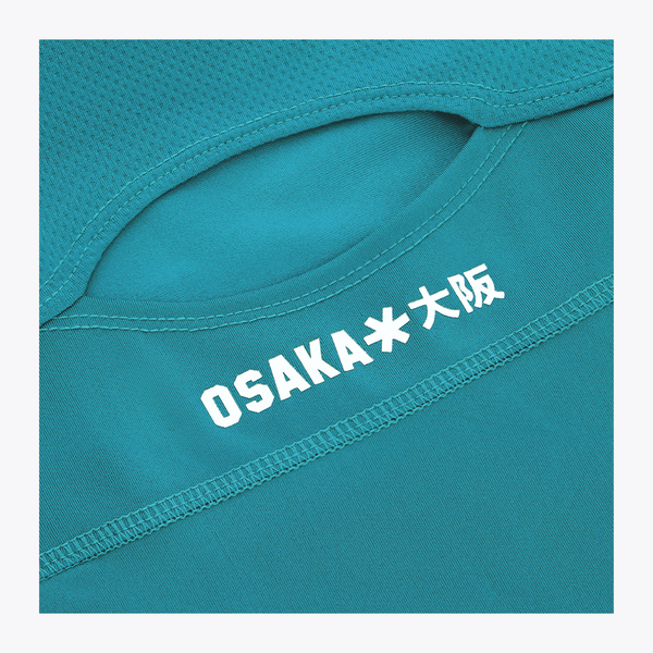 Osaka World Floucy Dress Transformative Teal | #TransformativeTeal | Close up of back logo