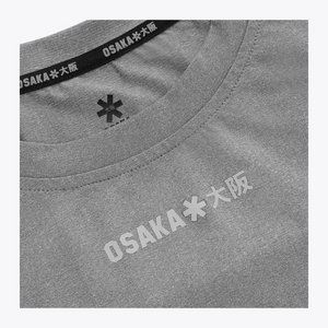 Reflective Osaka Osaka chest logo detail on the Osaka Men’s Apex Training Tee in Quiet Gray athletic performance shirt. #QuiteGray