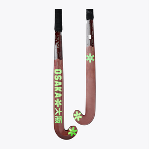 Field hockey stick pair view: dark brown blade with lime star accents and black handle. #GreenAsh