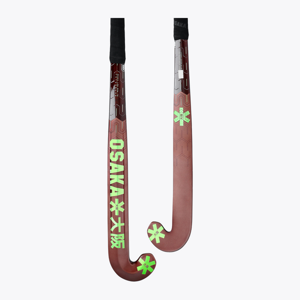 Field hockey stick pair view: dark brown blade with lime star accents and black handle. #GreenAsh