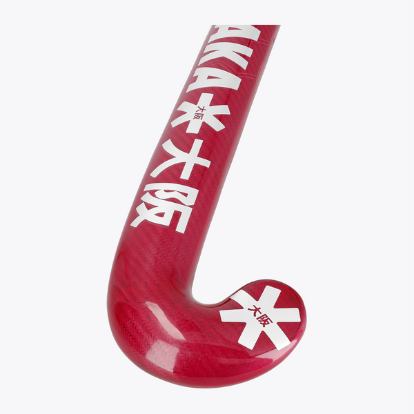 Hot pink curved field hockey blade with printed star logos and textured surface #HotPink | Osaka World