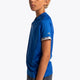Boy wearing the Osaka Kids Jersey in Royal blue. Side view