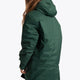 Girl wearing the Osaka Kids Stadium Jacket in Dark Green. Back view