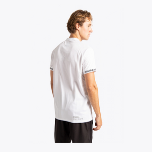 A man shown from the back wearing a white short-sleeve athletic t-shirt with black text on the sleeve cuffs and lower back, paired with black shorts, against a plain white studio background. #White