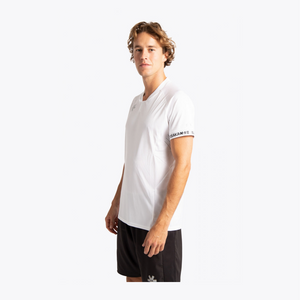 A man wearing a white short-sleeve athletic t-shirt with a black Under Armour logo on the chest and a black and white 'SONAMART' sleeve band, paired with black athletic shorts, set against a plain white background. #White